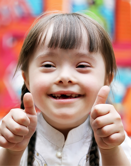 Little girl giving two thumbs up
