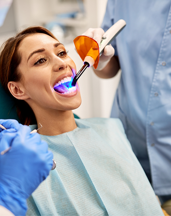 Female patient undergoing cosmetic bonding