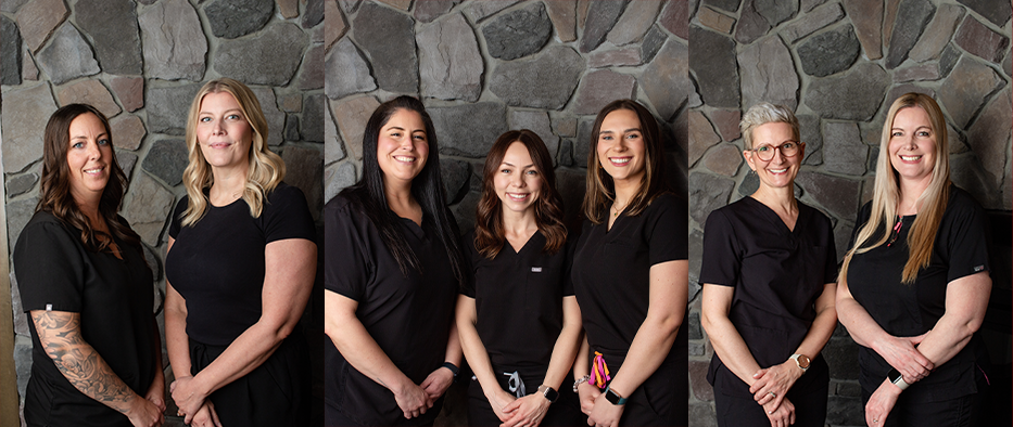 Spruce Grove dental team members standing in a row and smiling