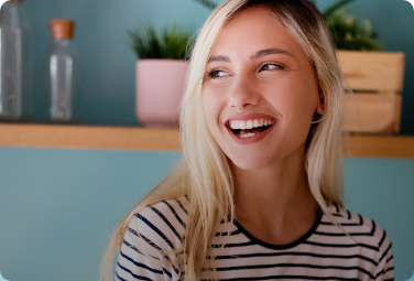 Smiling blonde woman with striped shirt