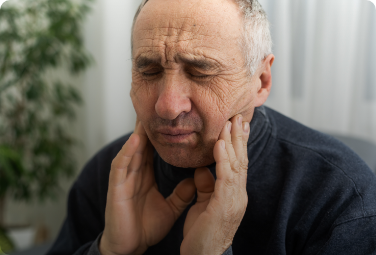 Older man with tooth pain