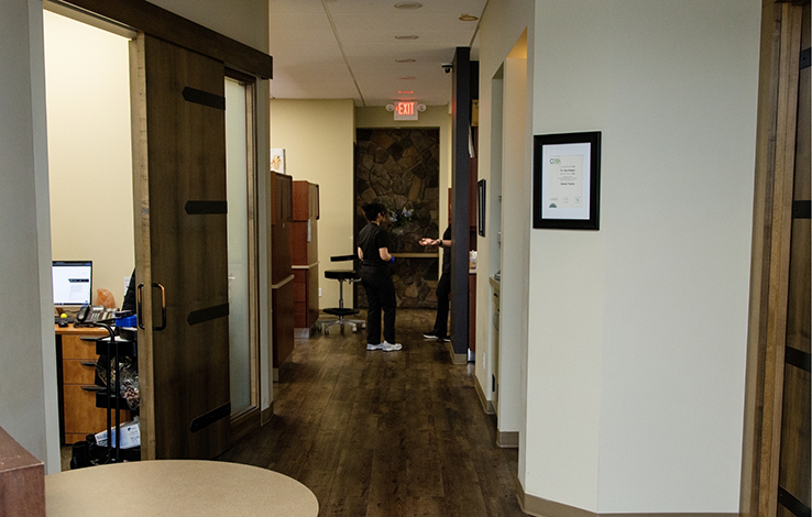 Hallway leading to treatment areas inside dental office