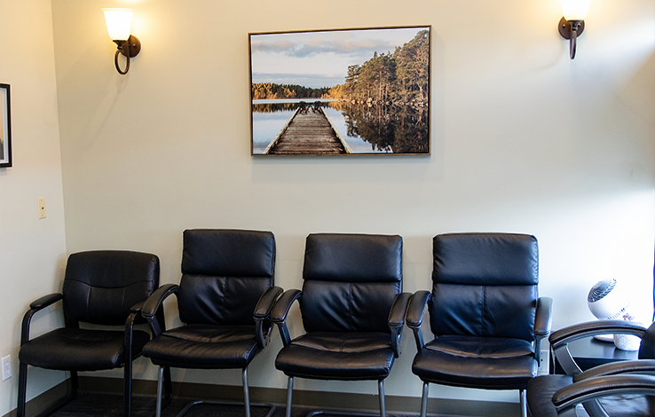 Chairs lined up against wall in dental office
