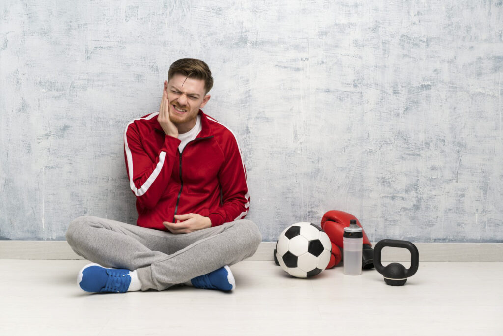 A soccer player with a toothache